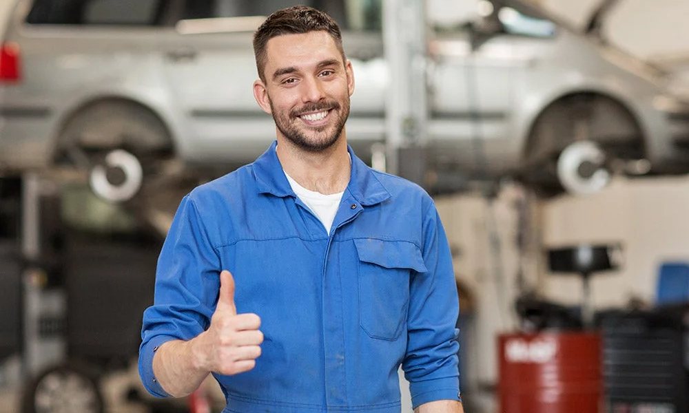 A mechanic giving a thumbs up
